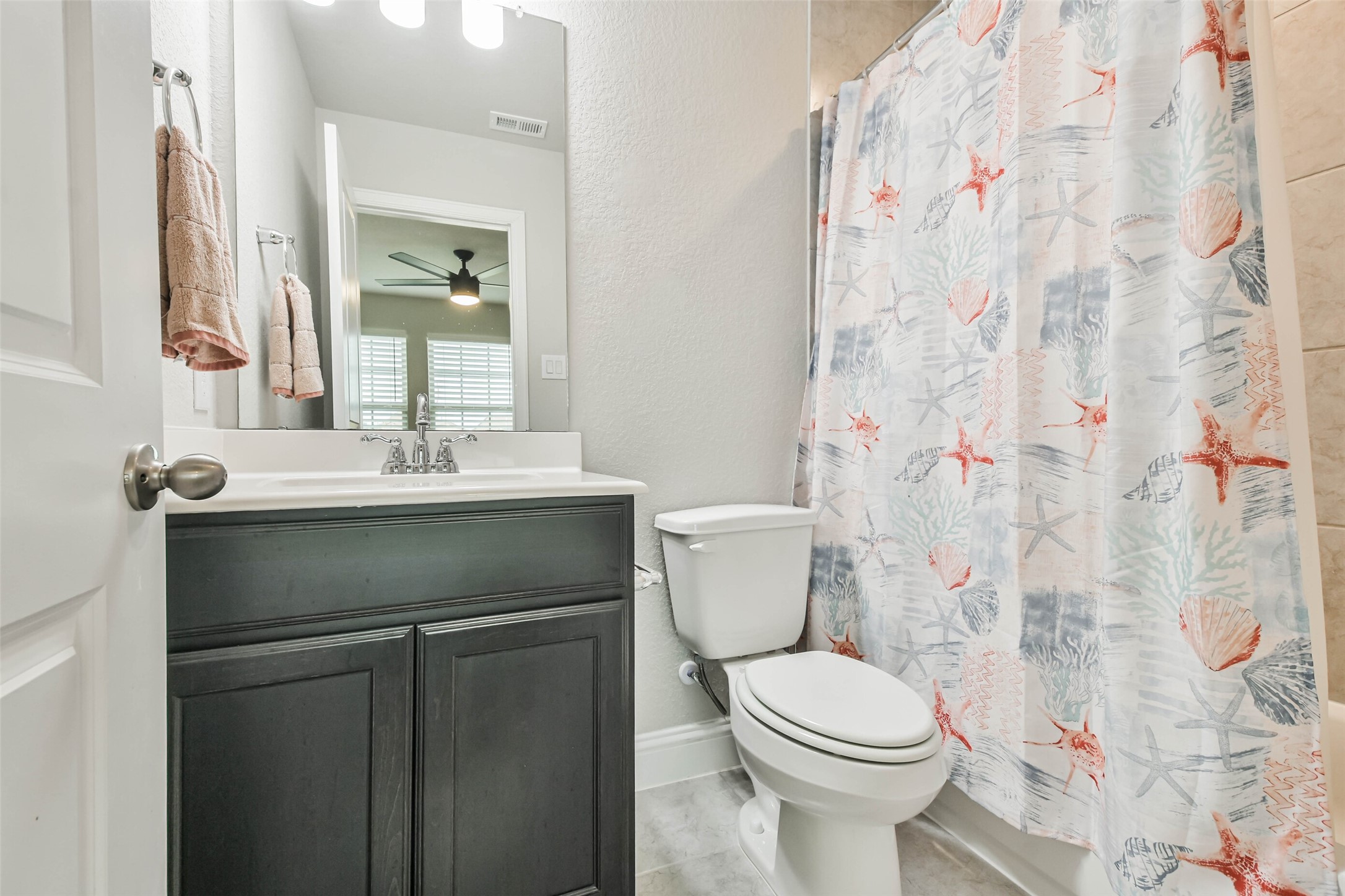 22095 Volante Drive Spring, TX 77386 - Photo 34 of 47 a bathroom with a sink toilet and shower