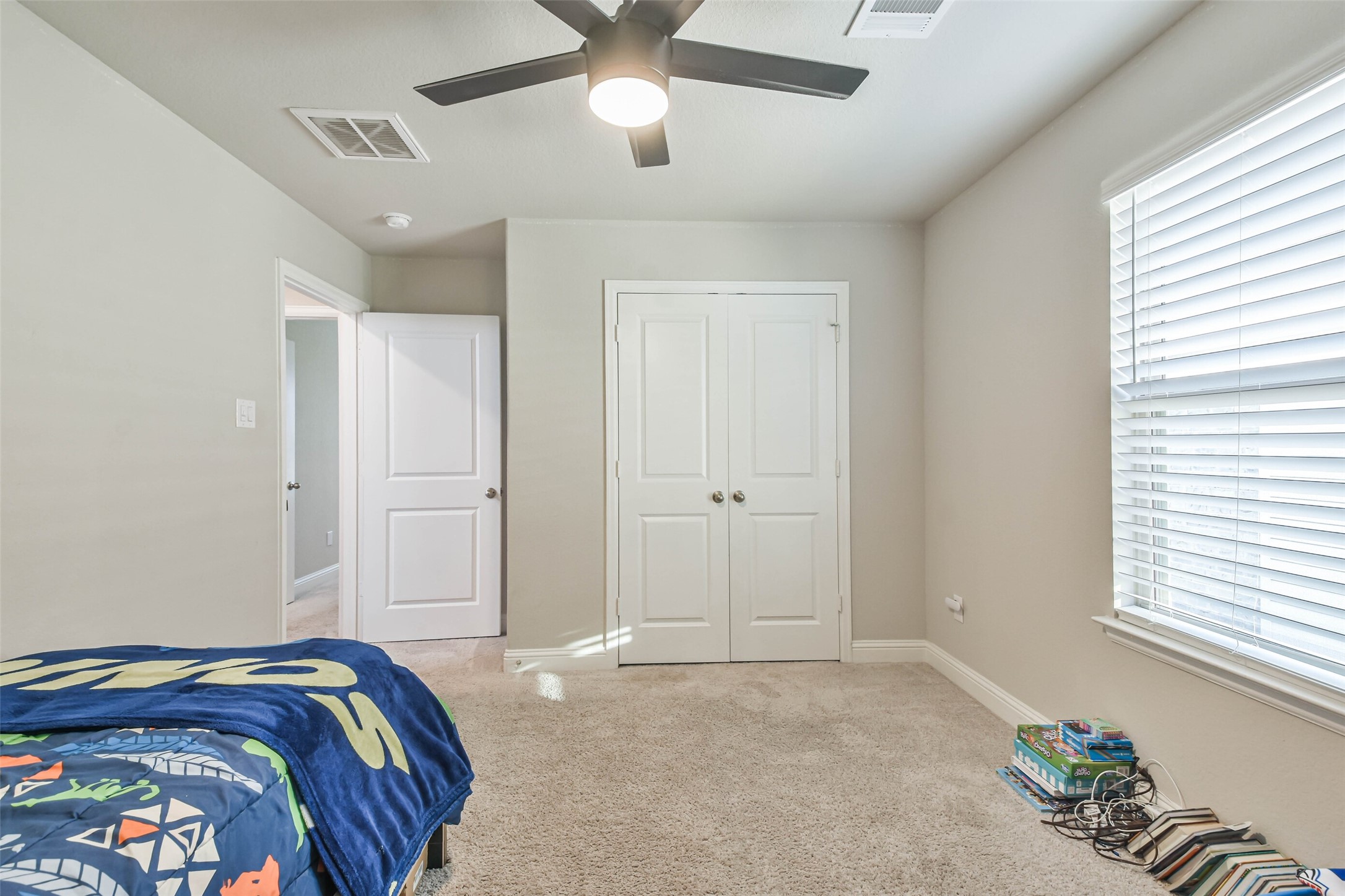 22095 Volante Drive Spring, TX 77386 - Photo 36 of 47 a bedroom with bed and a window