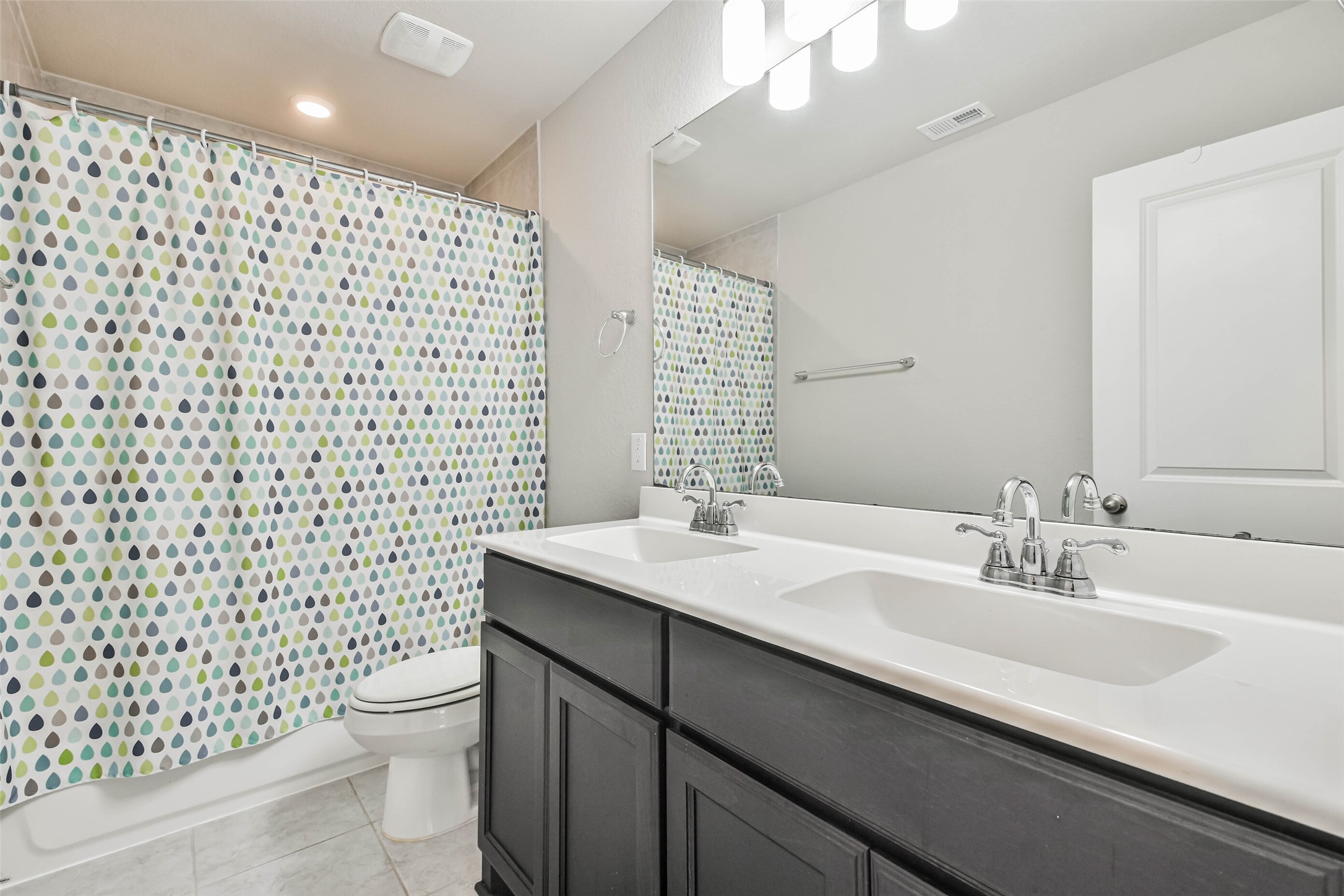 22095 Volante Drive Spring, TX 77386 - Photo 37 of 47 a bathroom with a sink a toilet and shower