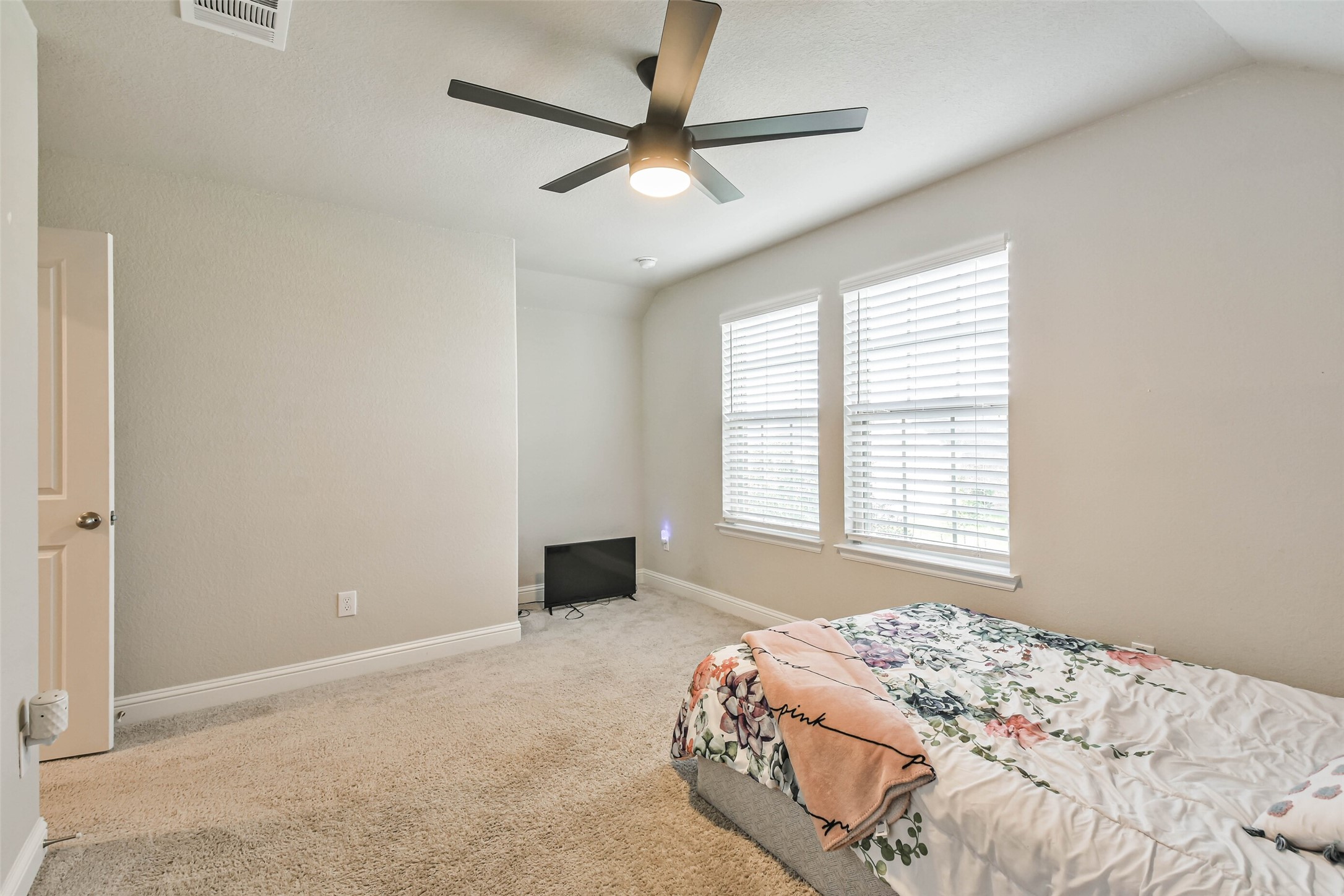 22095 Volante Drive Spring, TX 77386 - Photo 39 of 47 a bedroom with a bed and a window