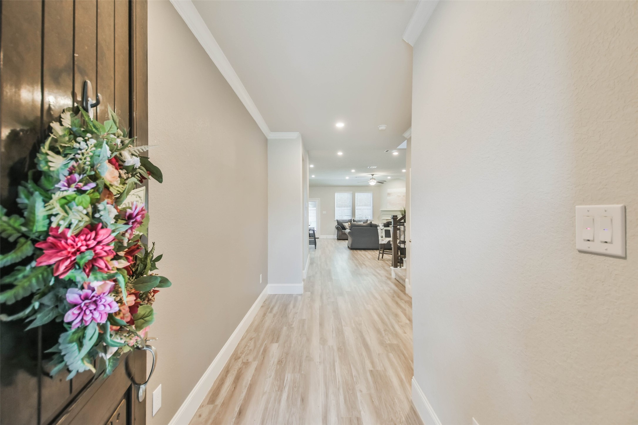 22095 Volante Drive Spring, TX 77386 - Photo 6 of 47 a hallway with beautiful flowers and flowers