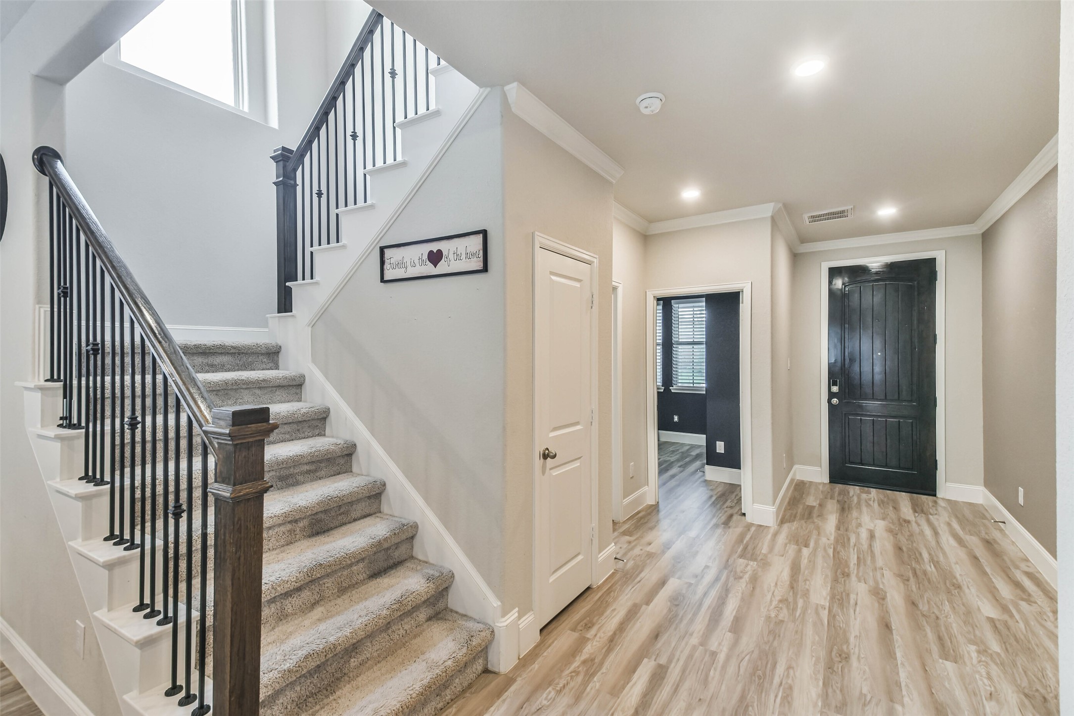 22095 Volante Drive Spring, TX 77386 - Photo 7 of 47 a view of a hallway with wooden floor and entryway