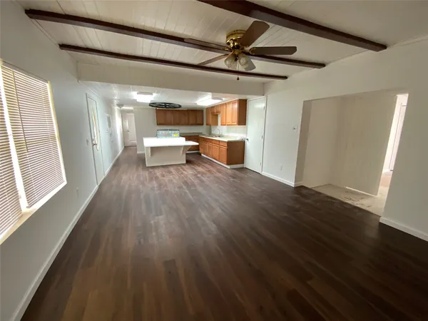 a view of a livingroom with wooden floor