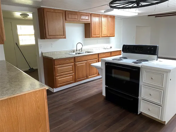 a kitchen with a stove and a sink