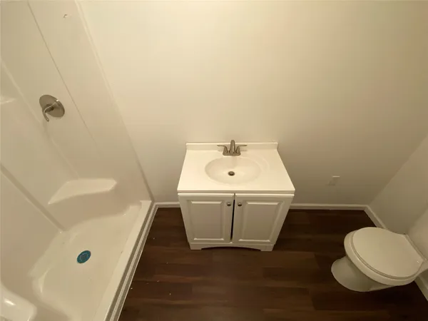 a bathroom with a sink a toilet and bathtub
