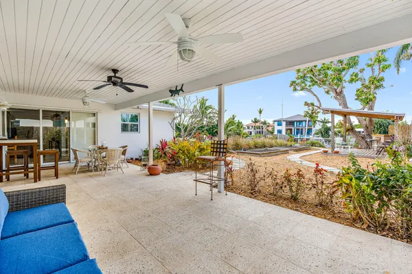 a view of a backyard with sitting area