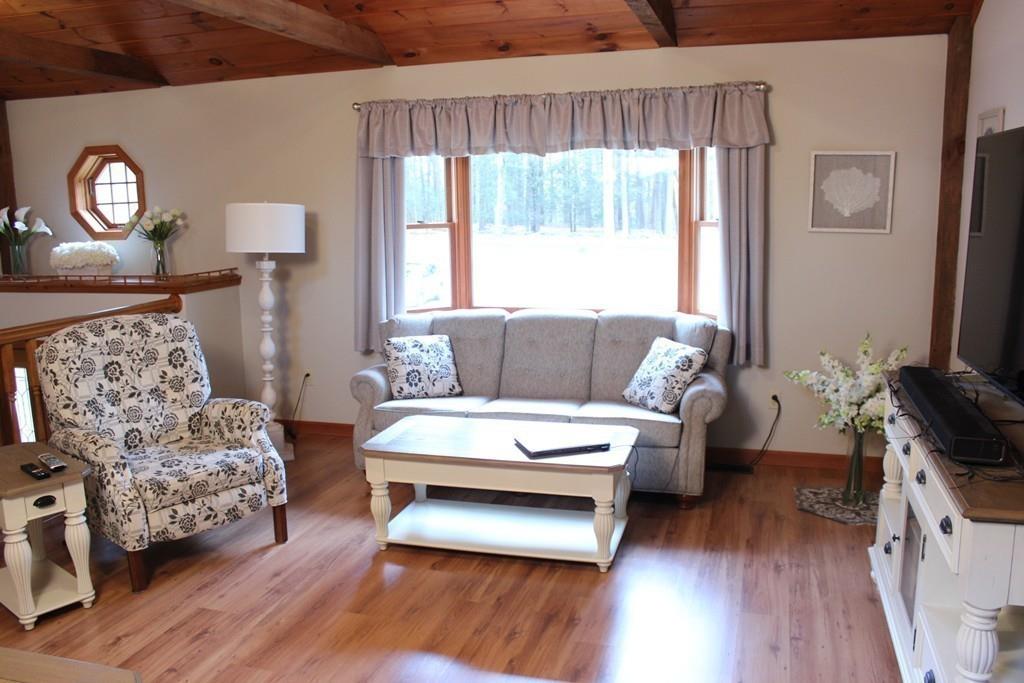 75 H Foote Road Charlton, MA 01507 - Photo 11 of 24 a living room with furniture and a large window