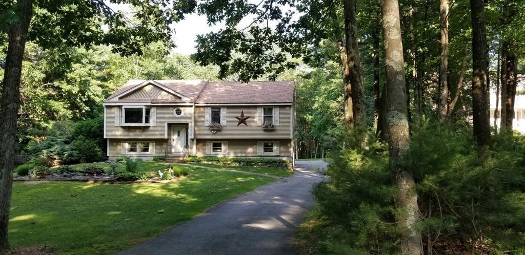 75 H Foote Road Charlton, MA 01507 - Photo 23 of 24 a view of a white house with a big yard plants and large trees