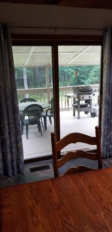 75 H Foote Road Charlton, MA 01507 - Photo 8 of 24 a bedroom with a bed and large windows