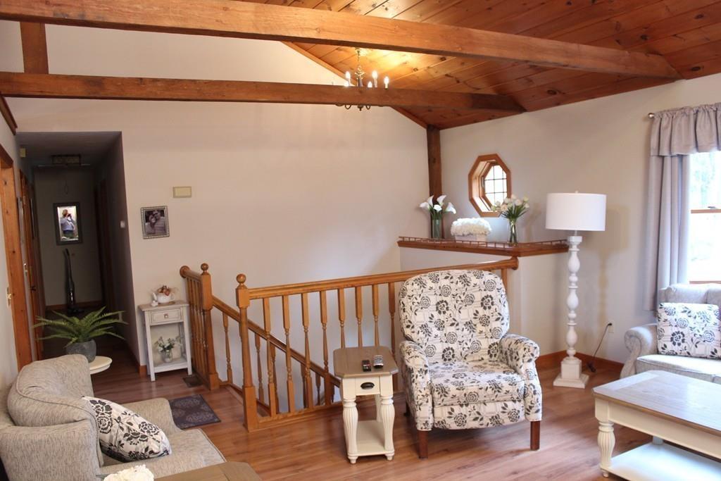 75 H Foote Road Charlton, MA 01507 - Photo 10 of 24 a view of a livingroom with furniture and windows