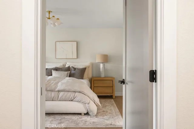 a bedroom with a bed and a mirror