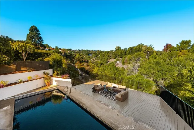 a view of a balcony with two chairs and a table