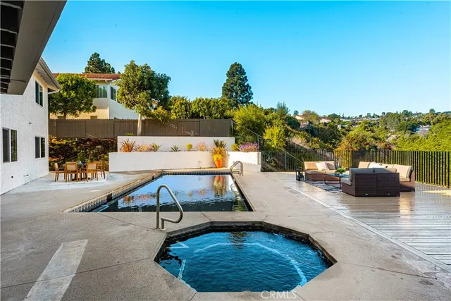 a view of a swimming pool with a lounge chairs