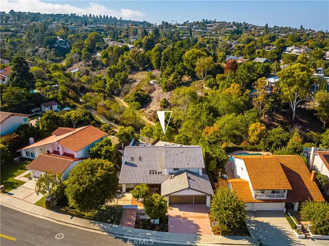 an aerial view of a house with a garden