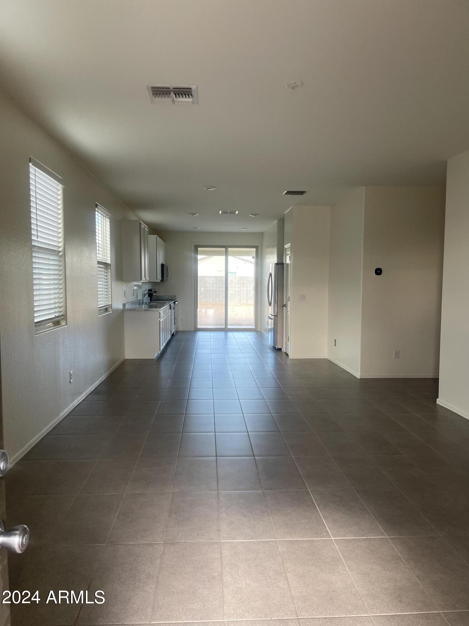 9536 Silo Circle Florence, AZ 85132 - Photo 2 of 12 a view of a kitchen with a sink and cabinets
