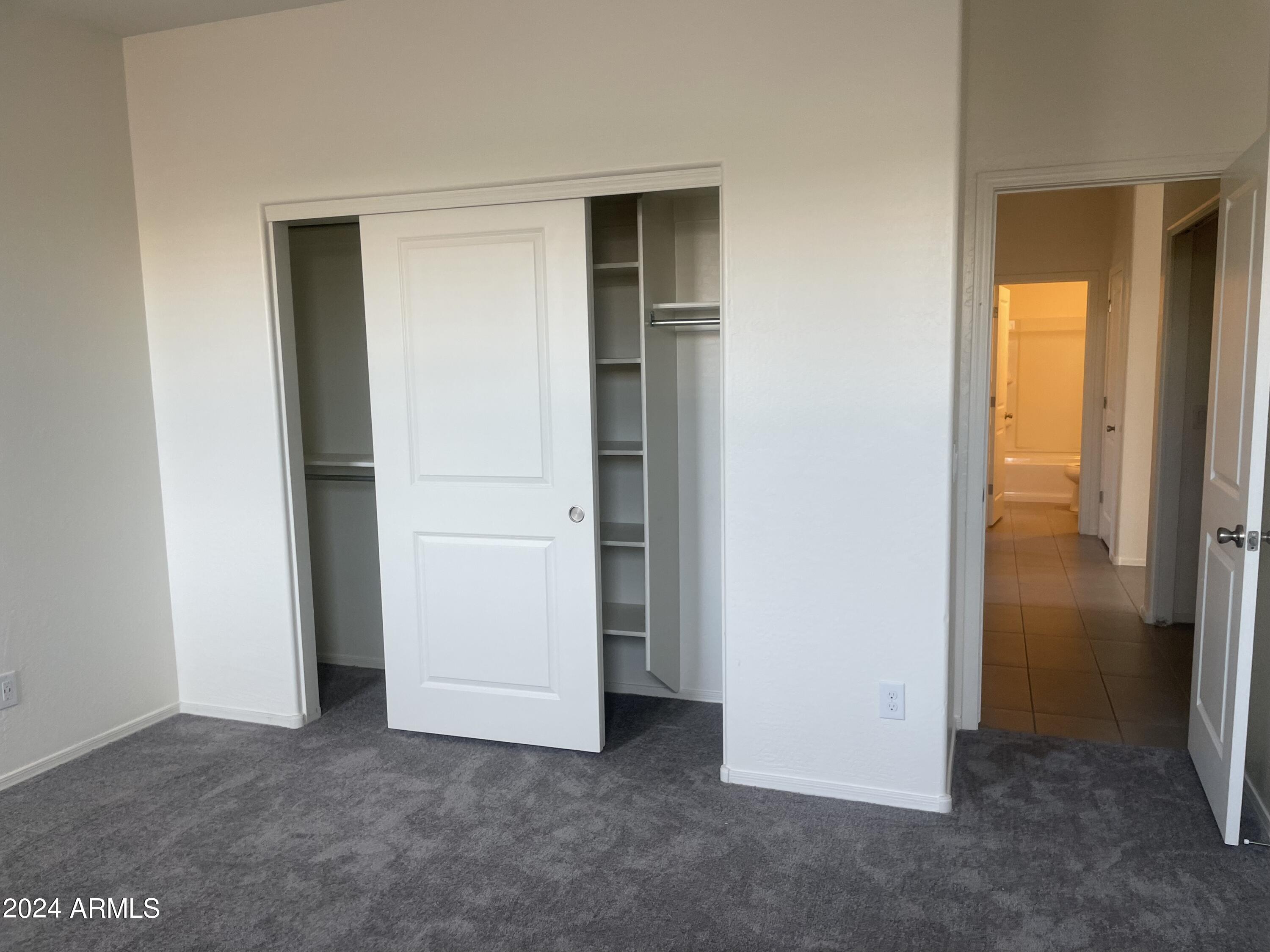 9536 Silo Circle Florence, AZ 85132 - Photo 4 of 12 an empty room with closet