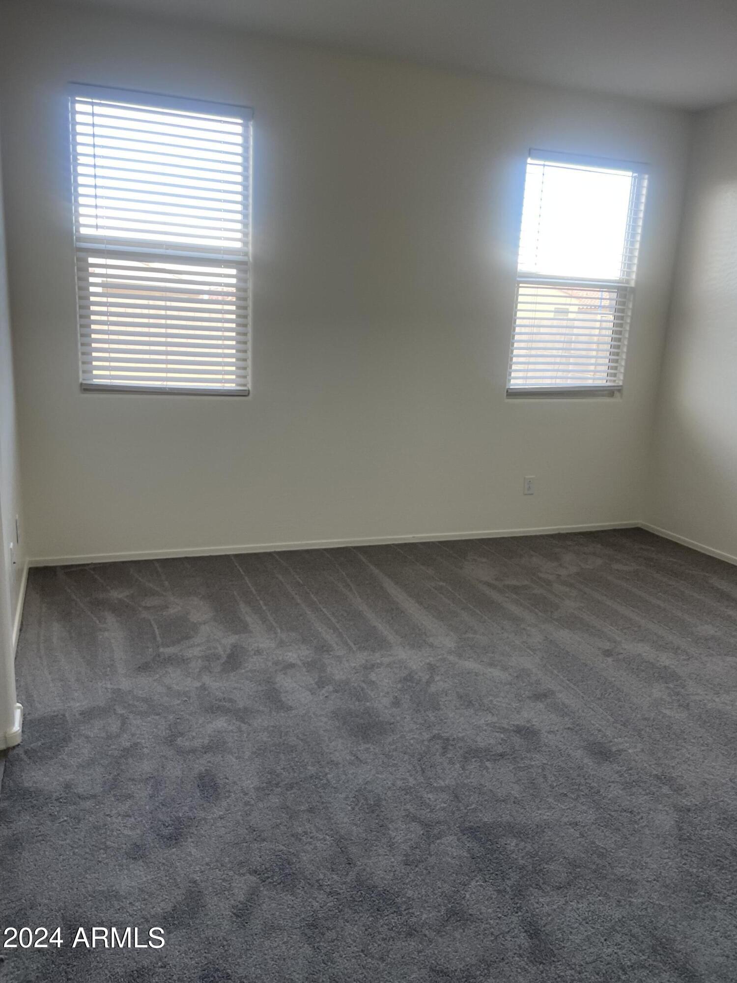 9536 Silo Circle Florence, AZ 85132 - Photo 5 of 12 an empty room with a window