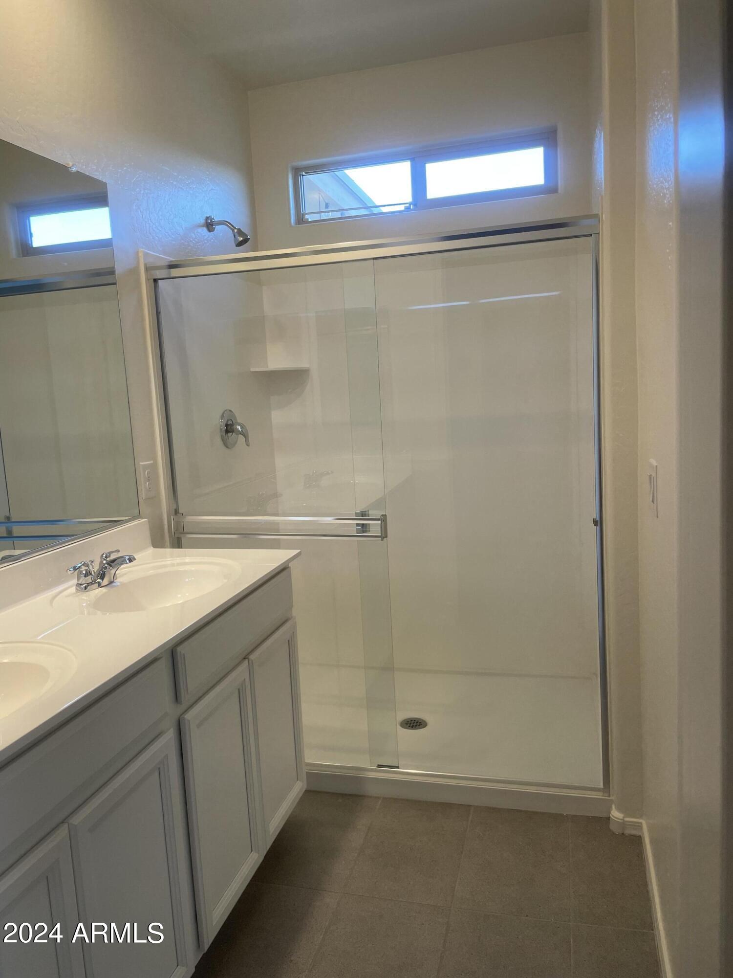 9536 Silo Circle Florence, AZ 85132 - Photo 6 of 12 a bathroom with a sink and a mirror