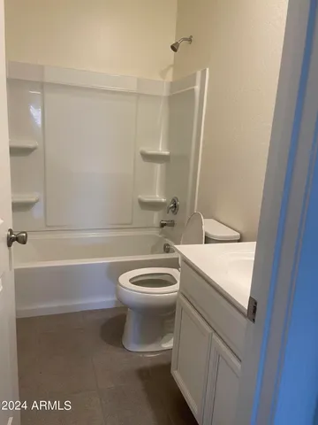 a bathroom with a toilet a sink and bathtub