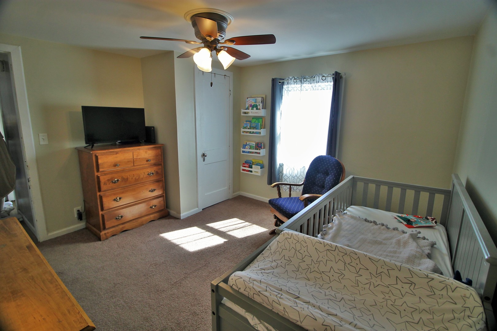 817 South Illinois Street Geneseo, IL 61254 - Photo 17 of 20 a living room with furniture and a flat screen tv
