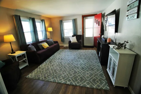 a living room with furniture and a flat screen tv