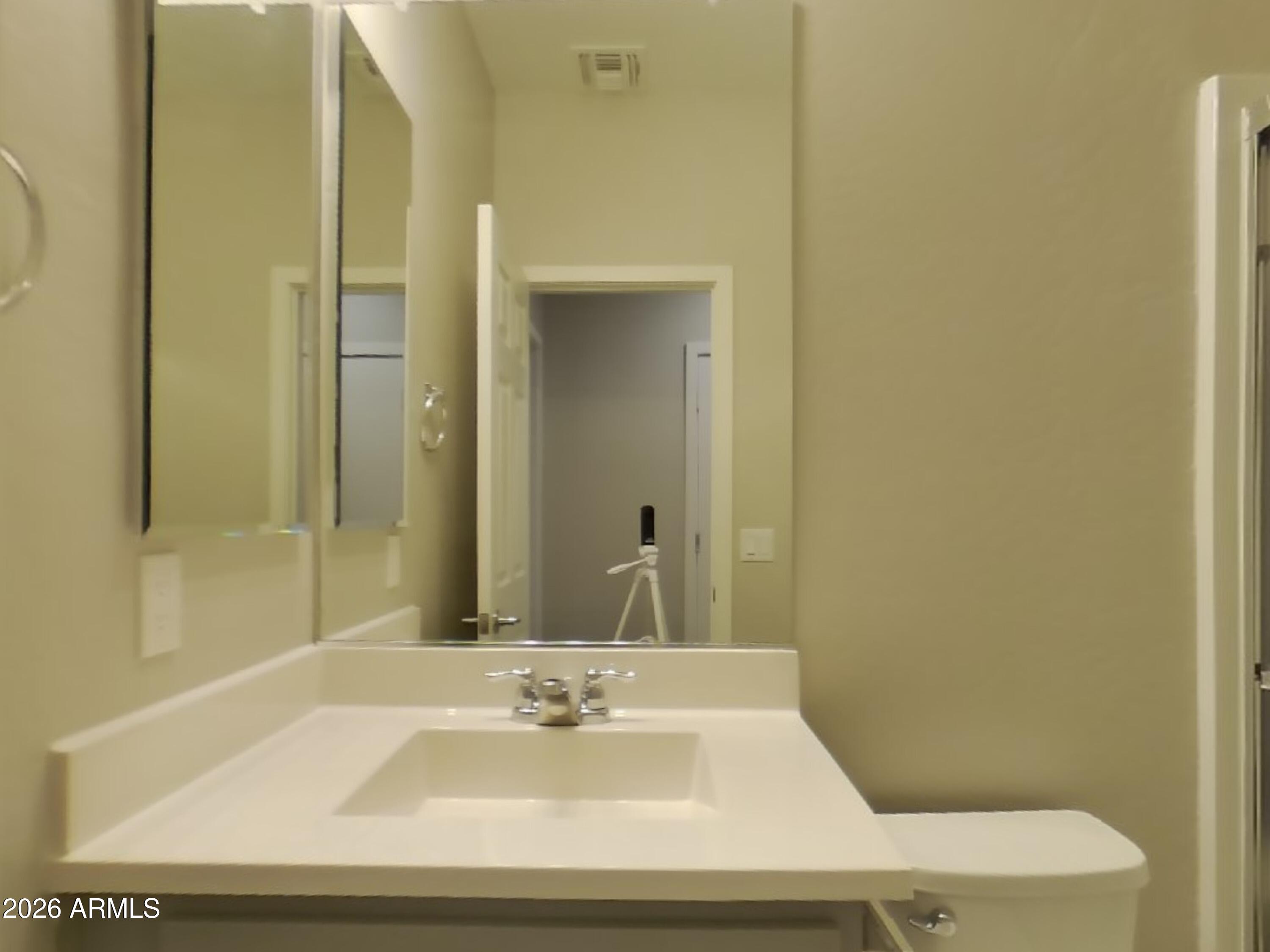 2630 East Danbury Road Phoenix, AZ 85032 - Photo 11 of 17 a bathroom with a sink and a mirror
