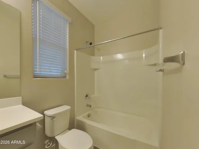 a bathroom with a toilet and a bathtub