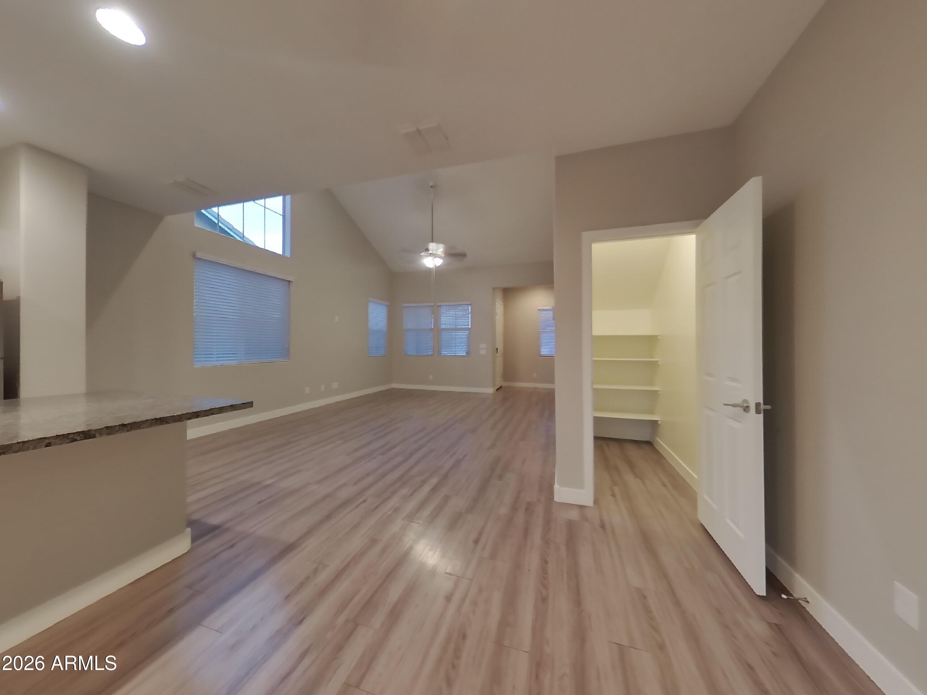 2630 East Danbury Road Phoenix, AZ 85032 - Photo 3 of 17 a view of empty room with wooden floor