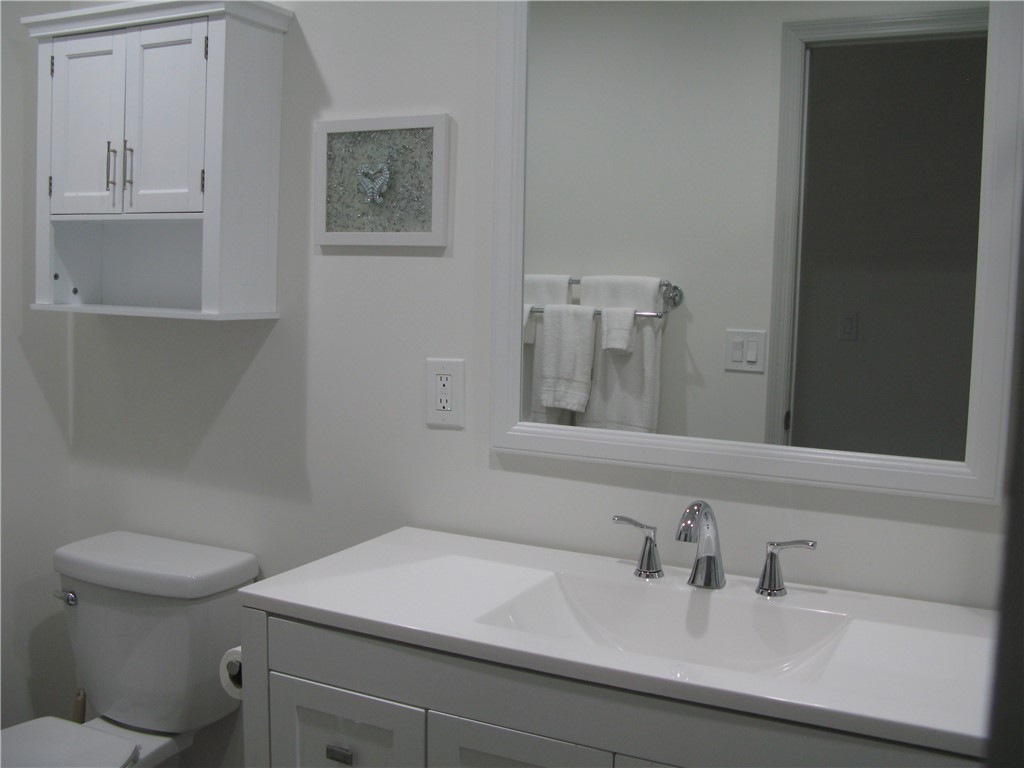 3700 Bay Street Sebastian, FL 32976 - Photo 27 of 35 a bathroom with a sink and a toilet