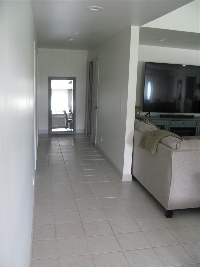 3700 Bay Street Sebastian, FL 32976 - Photo 28 of 35 a living room with a flat screen tv and a fireplace