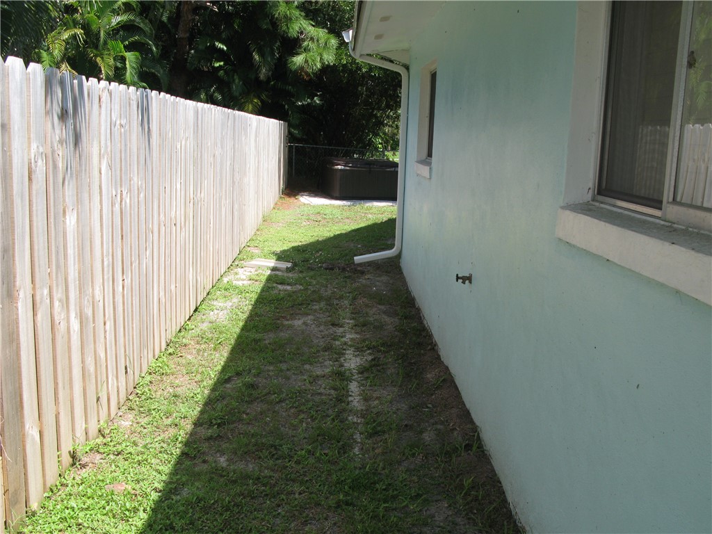 3700 Bay Street Sebastian, FL 32976 - Photo 34 of 35 a view of a pathway with a yard