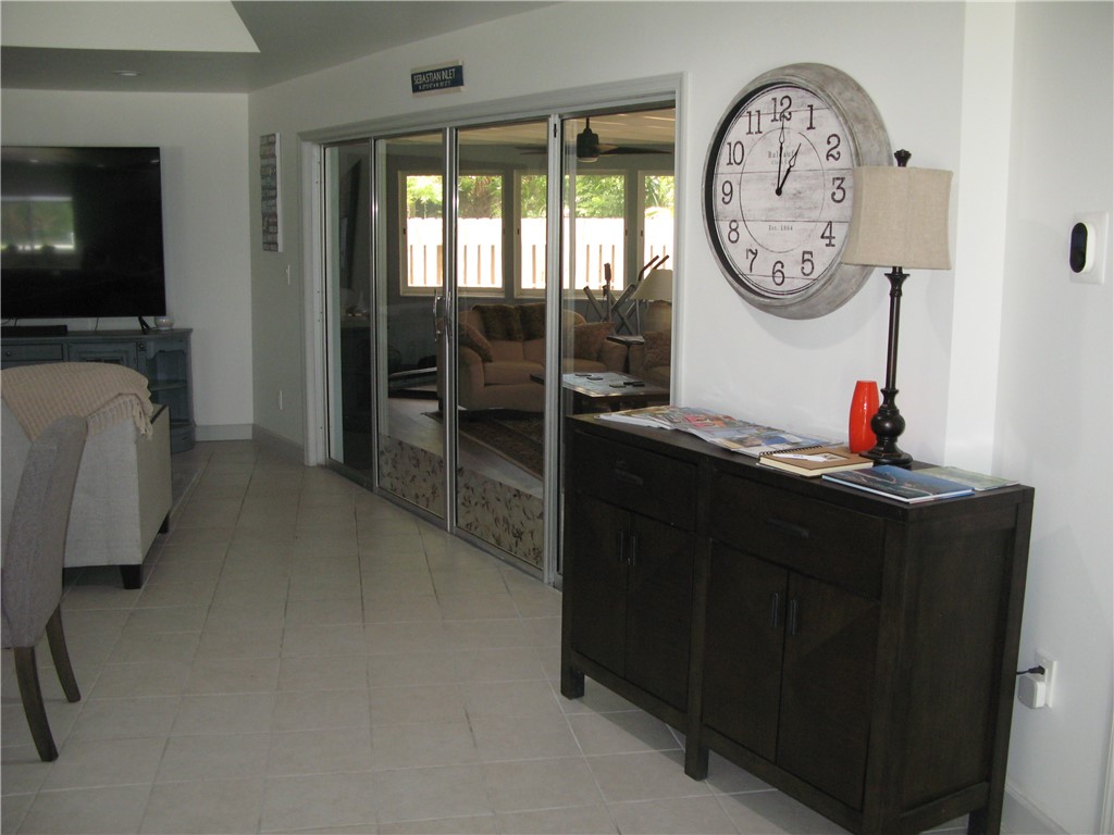 3700 Bay Street Sebastian, FL 32976 - Photo 8 of 35 a living room with chair and a mirror