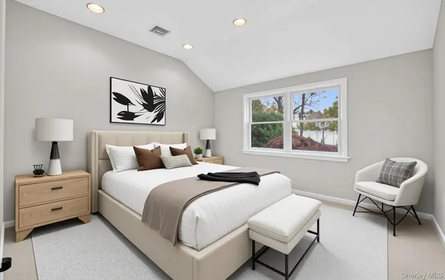 a bedroom with a bed and a couch