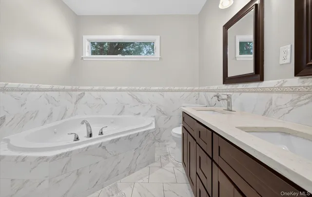 a bathroom with a bathtub and a sink