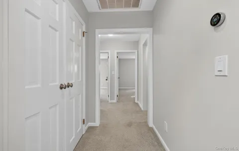 a view of a bathroom from a hallway