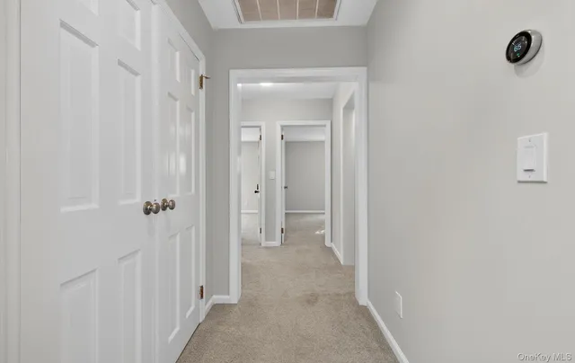 a view of a bathroom from a hallway