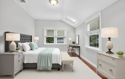 a bedroom with bed and window