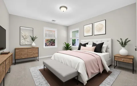 a bedroom with a large bed and a couch