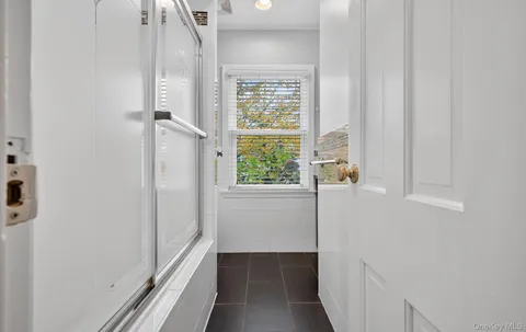 a view of a hallway with a window