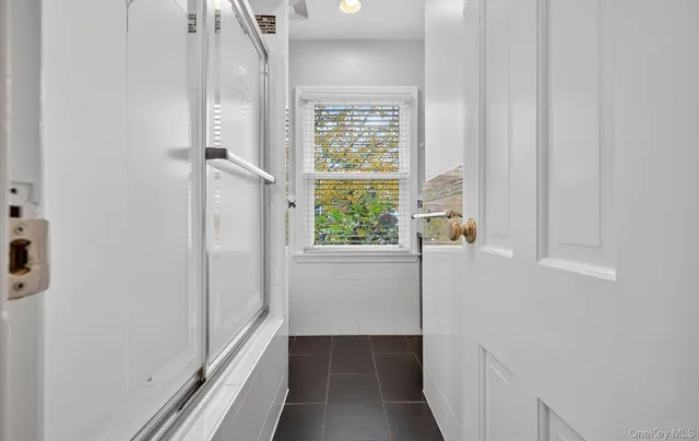 a view of a hallway with a window