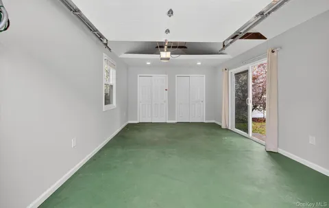 a view of a livingroom with a ceiling fan and window