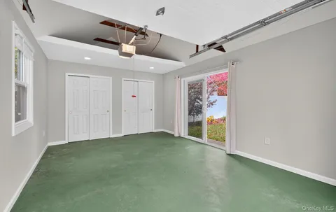 a view of field with trees in the background