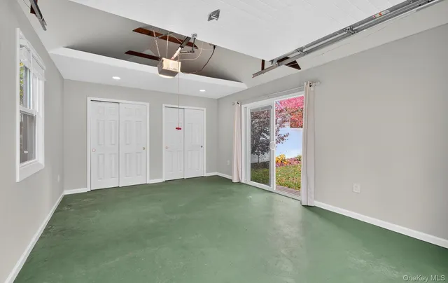 a view of field with trees in the background