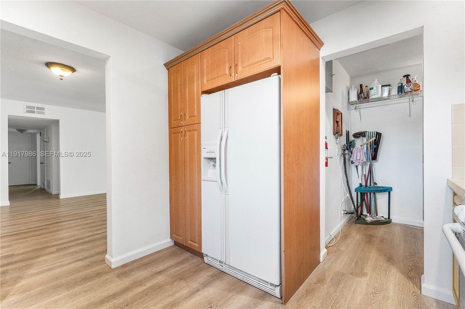475 Northwest 46th Terrace Plantation, FL 33317 - Photo 13 of 43 a view of a hallway with bathroom and wooden floor
