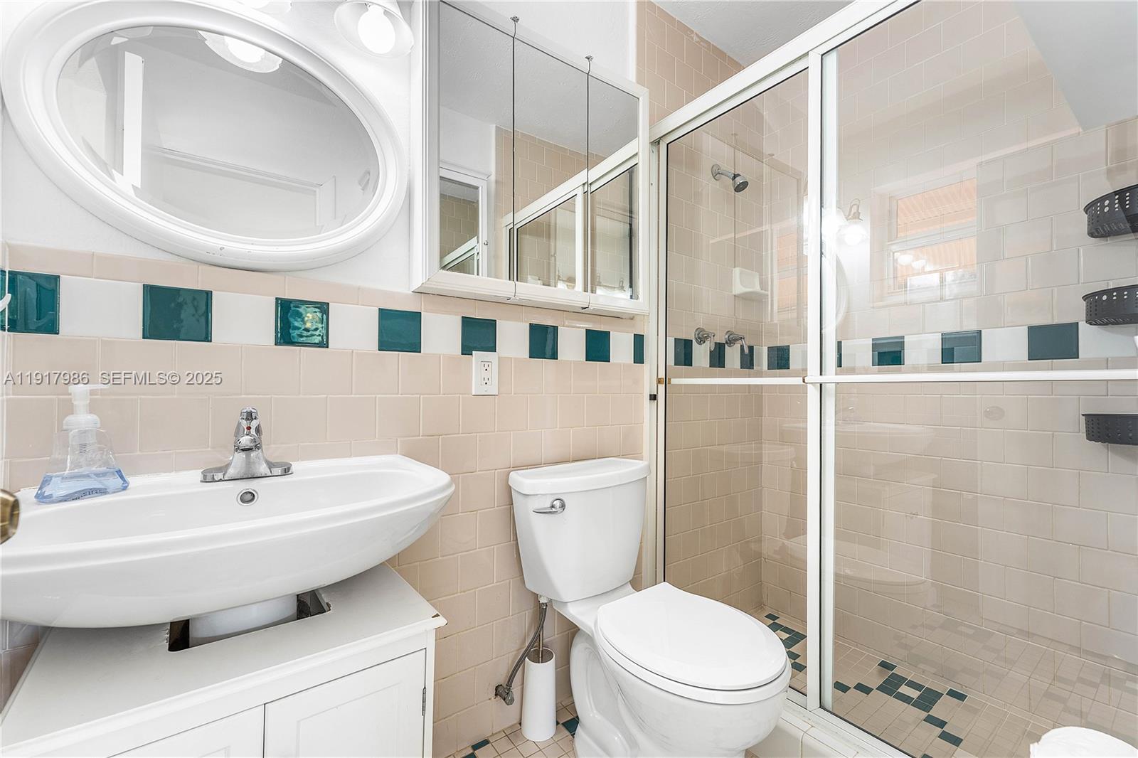 475 Northwest 46th Terrace Plantation, FL 33317 - Photo 24 of 43 a bathroom with a sink a toilet and a mirror