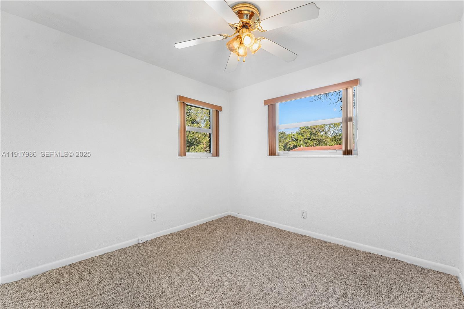 475 Northwest 46th Terrace Plantation, FL 33317 - Photo 25 of 43 an empty room with a window and a fan