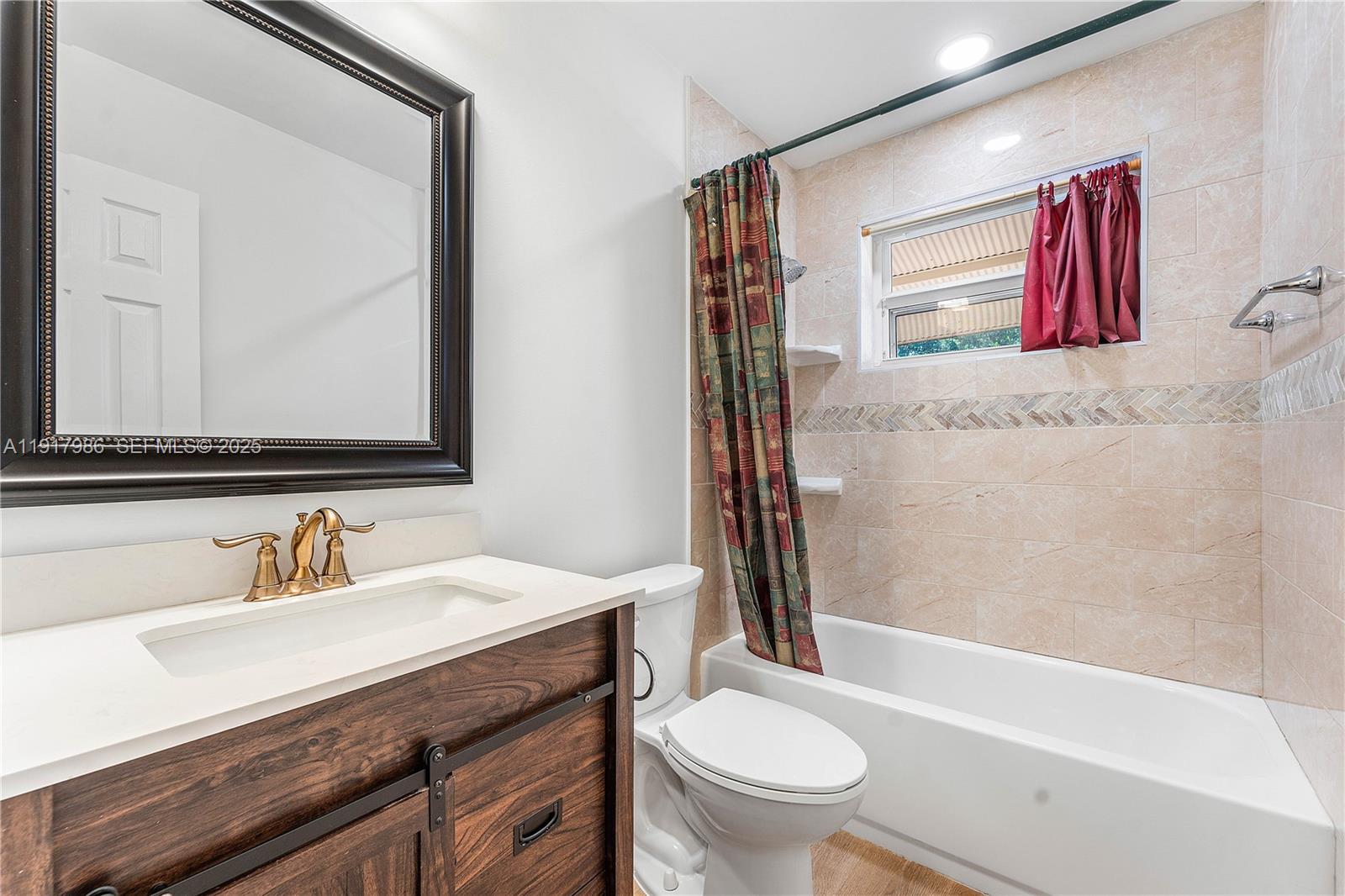475 Northwest 46th Terrace Plantation, FL 33317 - Photo 27 of 43 a bathroom with a sink and a mirror