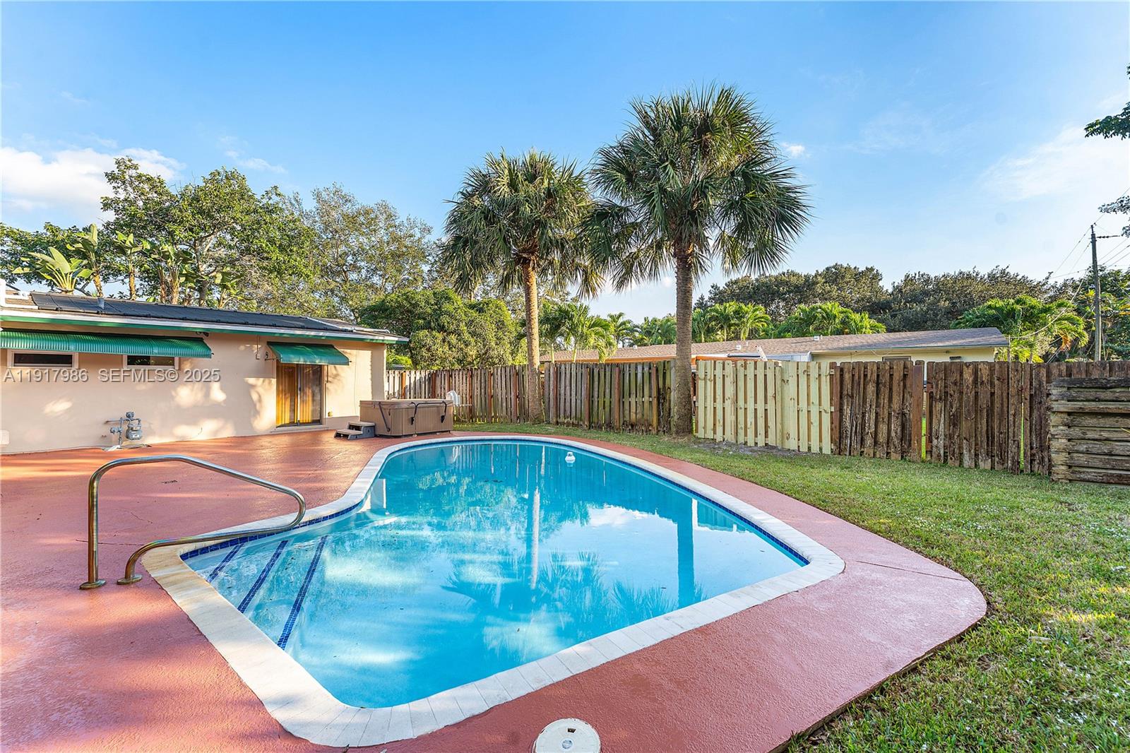 475 Northwest 46th Terrace Plantation, FL 33317 - Photo 29 of 43 a view of a swimming pool with a patio