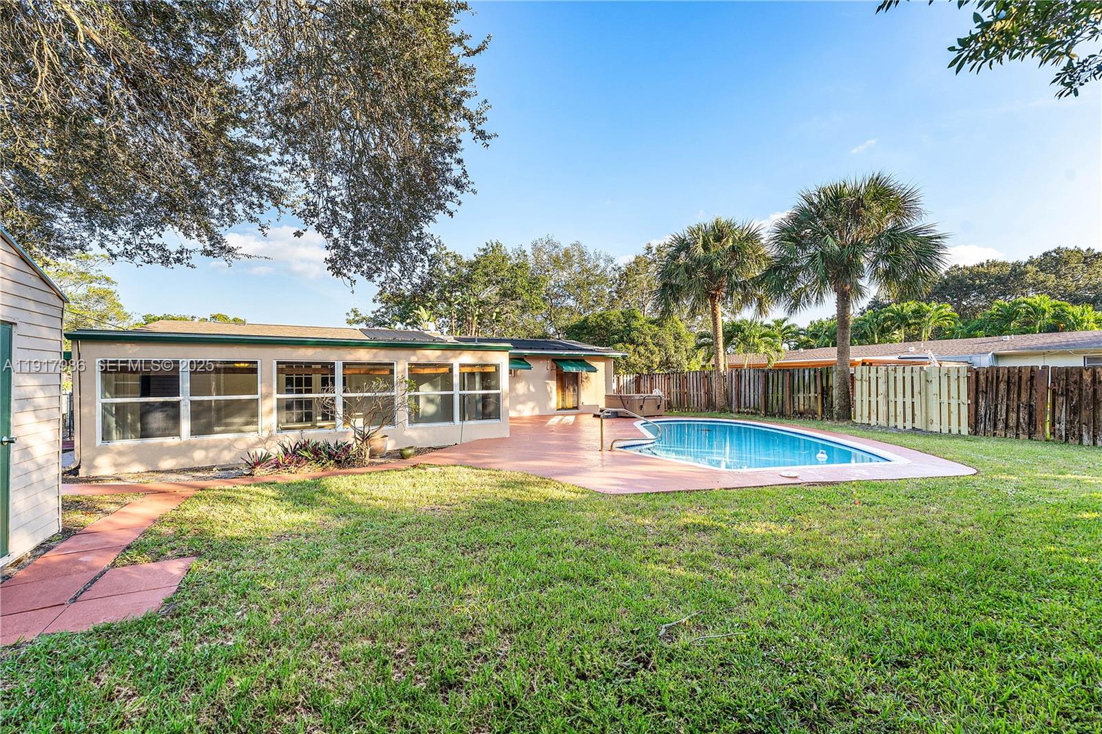 475 Northwest 46th Terrace Plantation, FL 33317 - Photo 32 of 43 a view of a house with a yard patio and swimming pool