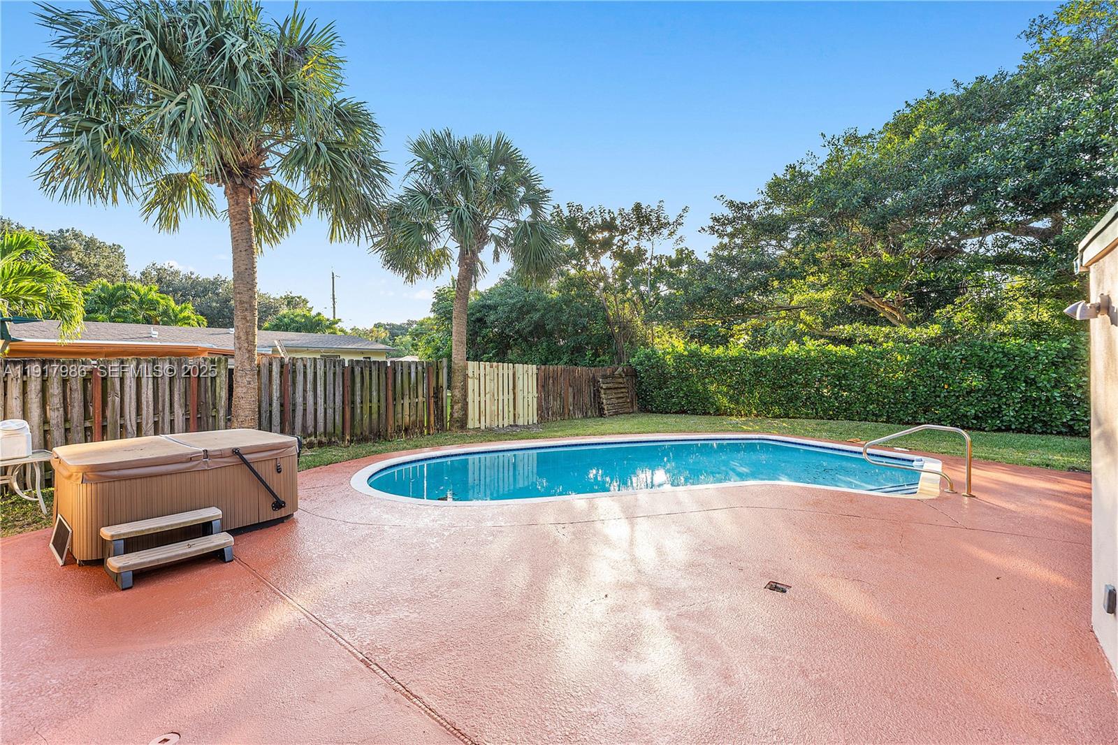 475 Northwest 46th Terrace Plantation, FL 33317 - Photo 34 of 43 a view of swimming pool and sitting area in the backyard